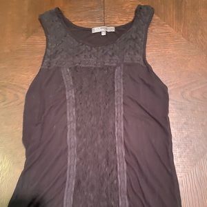 Black no sleeve lace front shirt.